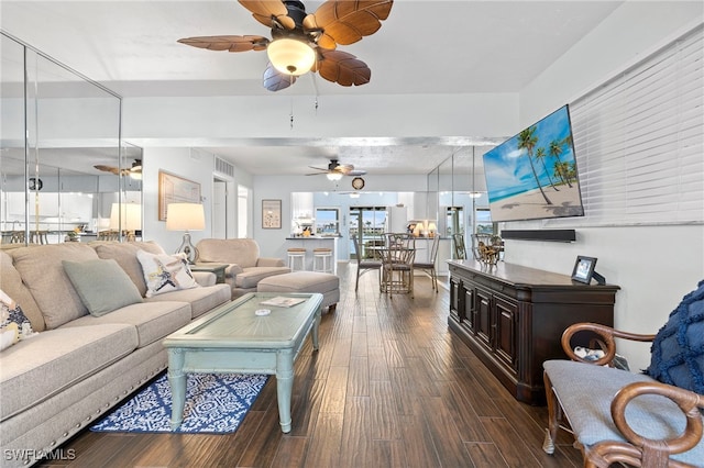 living room with hardwood / wood-style floors and ceiling fan