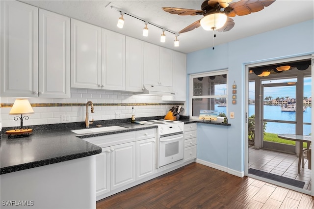 kitchen featuring dark hardwood / wood-style floors, white electric stove, white cabinetry, sink, and a water view