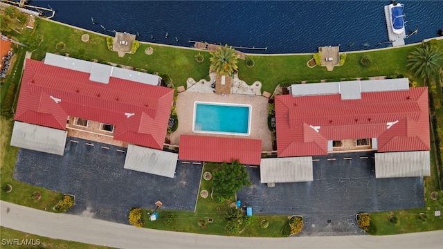 birds eye view of property with a water view