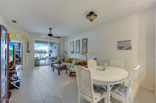 dining area featuring ceiling fan and light tile patterned floors