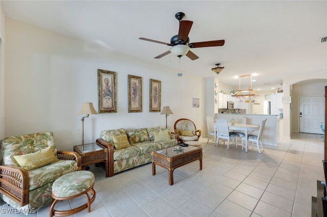 living room featuring ceiling fan and light tile patterned floors