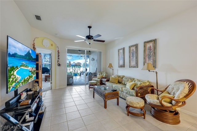 tiled living room featuring ceiling fan