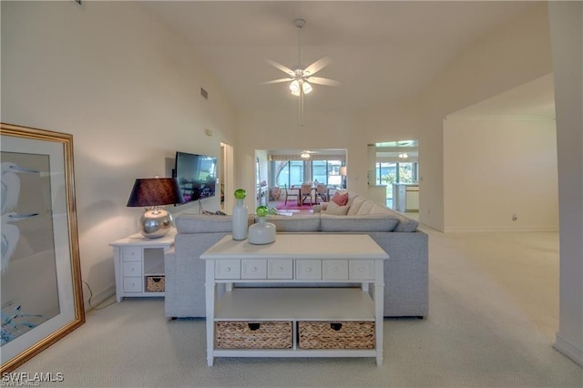 living room featuring ceiling fan, light carpet, and high vaulted ceiling