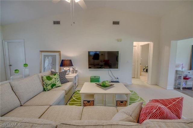 living room with vaulted ceiling and light carpet