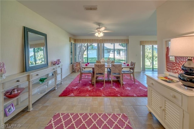 dining space featuring ceiling fan