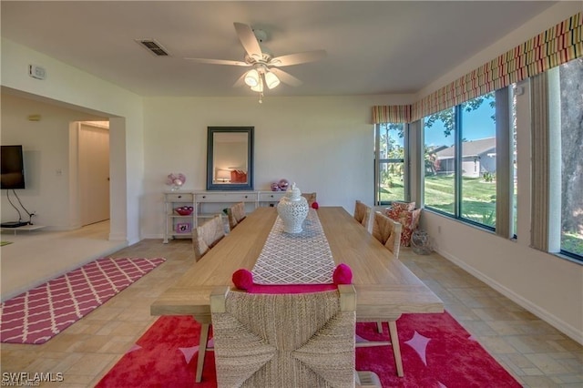 dining space featuring ceiling fan