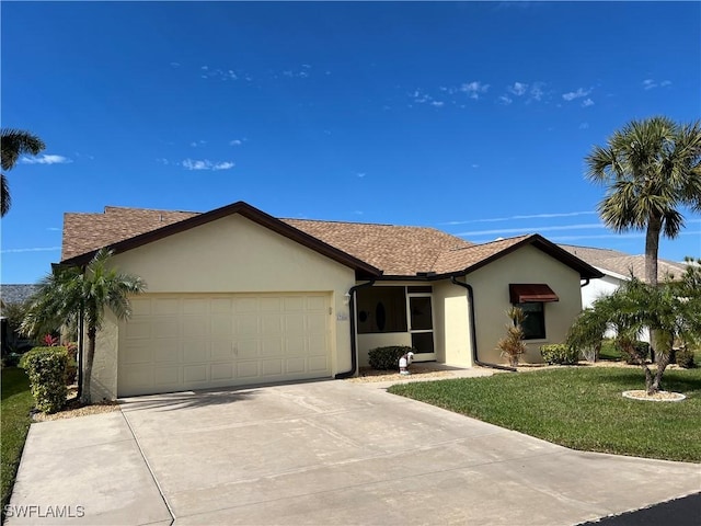 ranch-style house with a garage and a front lawn