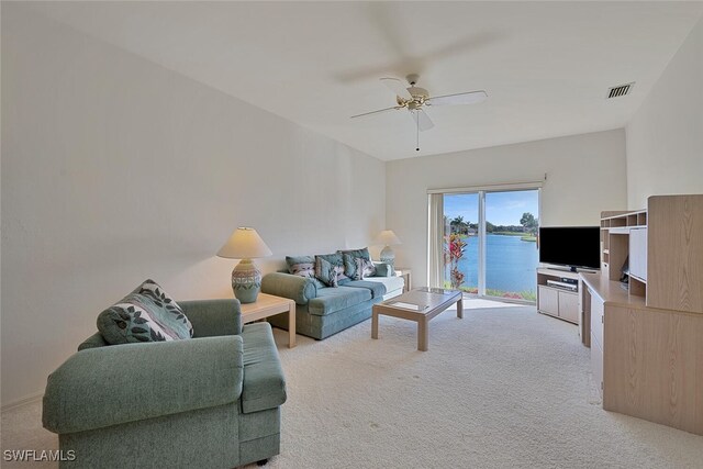 living room with light carpet and ceiling fan