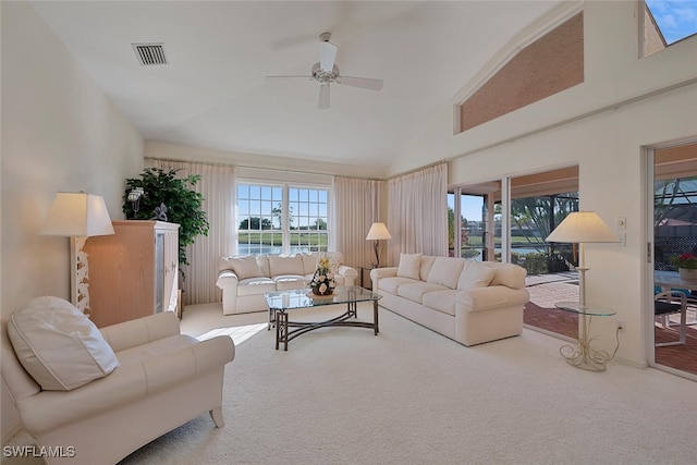 living room featuring ceiling fan, carpet flooring, and high vaulted ceiling