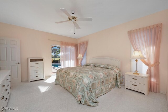 bedroom featuring light carpet, access to exterior, and ceiling fan