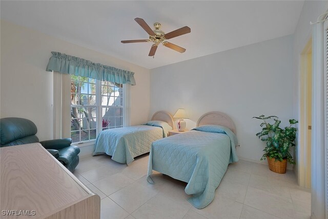 bedroom with light tile patterned flooring and ceiling fan