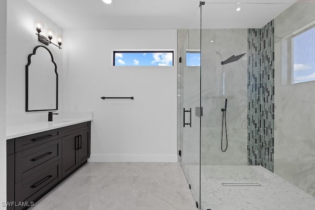 bathroom with vanity and a shower with shower door