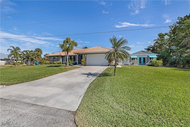 view of front of home featuring a garage and a front yard