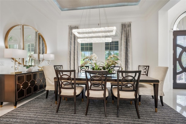 dining space featuring an inviting chandelier and ornamental molding