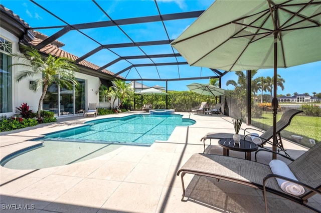 view of swimming pool featuring an in ground hot tub, a lanai, and a patio area