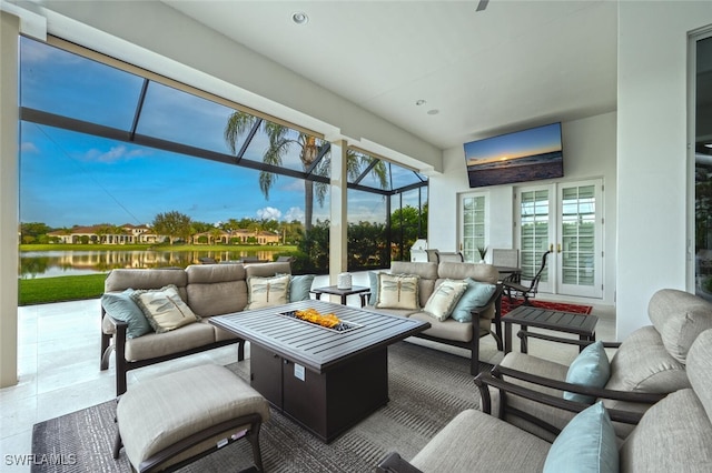 sunroom / solarium with a healthy amount of sunlight and a water view