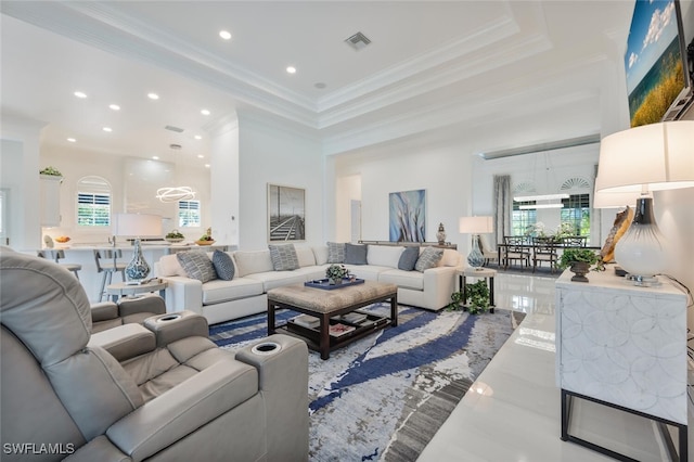 living room featuring ornamental molding and tile patterned flooring