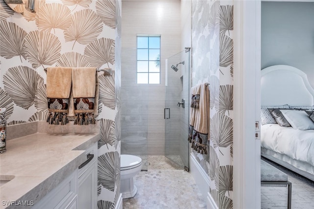 bathroom with vanity, toilet, and an enclosed shower