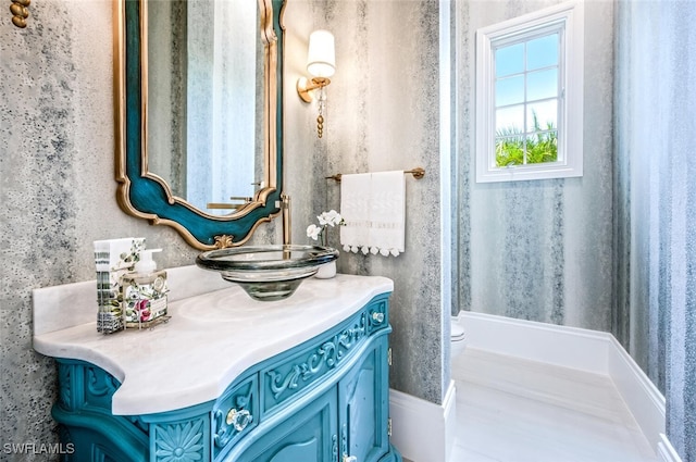 bathroom with vanity and toilet