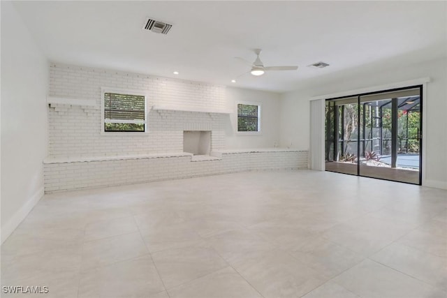 unfurnished living room featuring ceiling fan and light tile patterned floors