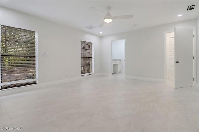 unfurnished living room featuring ceiling fan