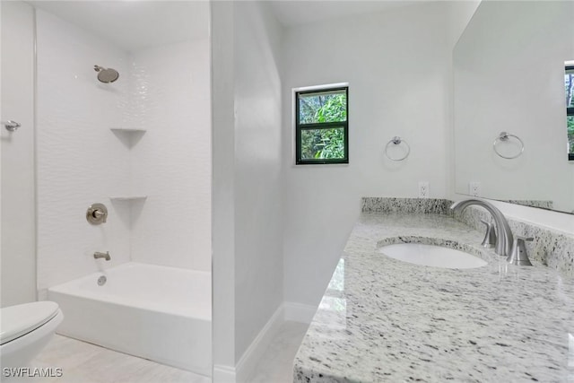 full bathroom with vanity, tiled shower / bath combo, tile patterned floors, and toilet