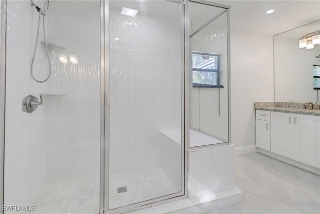 bathroom with vanity and walk in shower