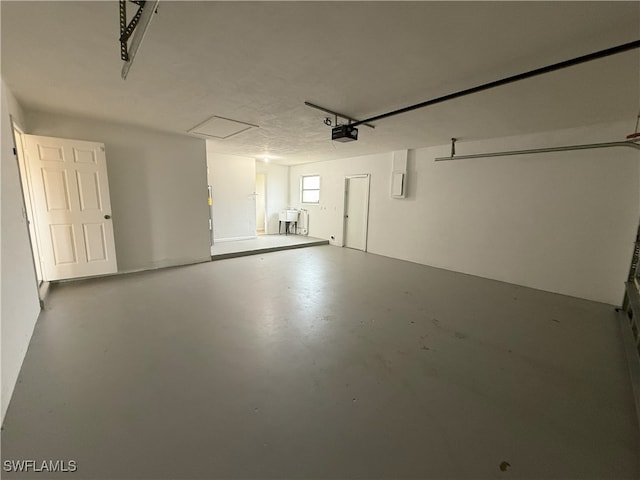 garage with sink and a garage door opener