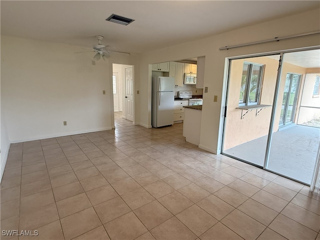 interior space featuring ceiling fan