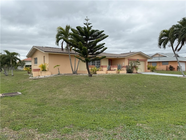 ranch-style home with a garage and a front yard