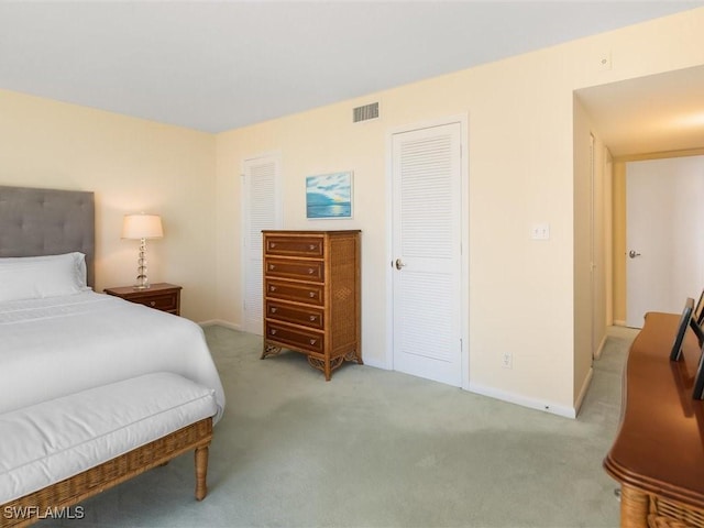 bedroom with light colored carpet