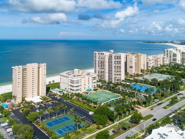 bird's eye view featuring a water view and a beach view