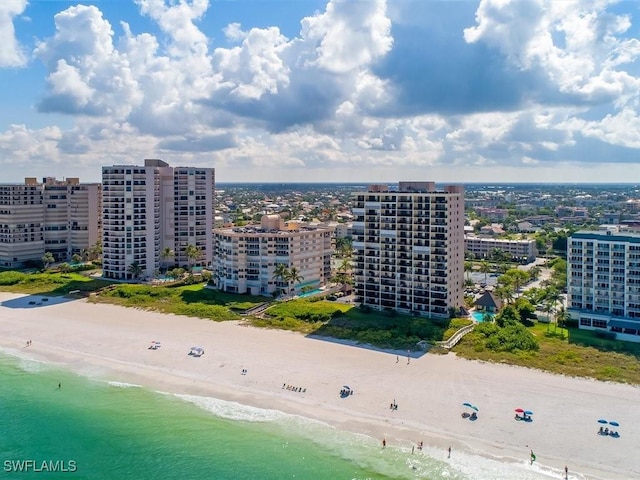 aerial view featuring a water view and a beach view