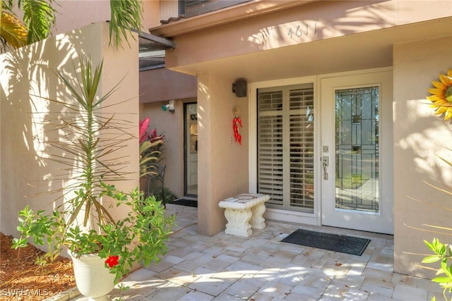 property entrance featuring a patio