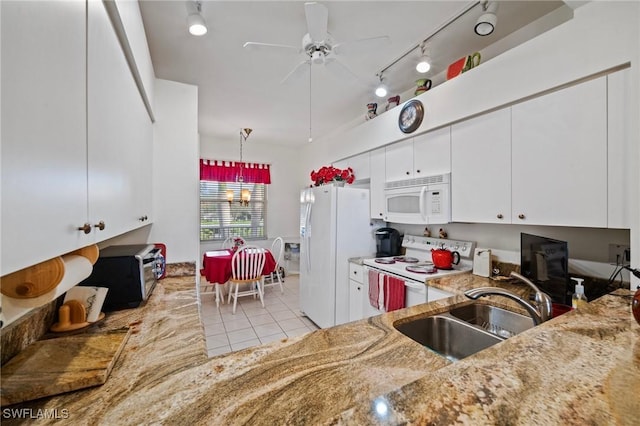 kitchen with sink, white appliances, light tile patterned floors, ceiling fan, and white cabinetry