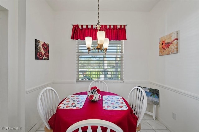 tiled dining space with an inviting chandelier