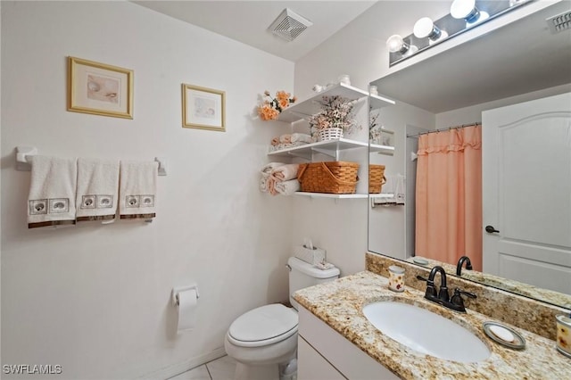 bathroom with vanity, a shower with curtain, tile patterned floors, and toilet