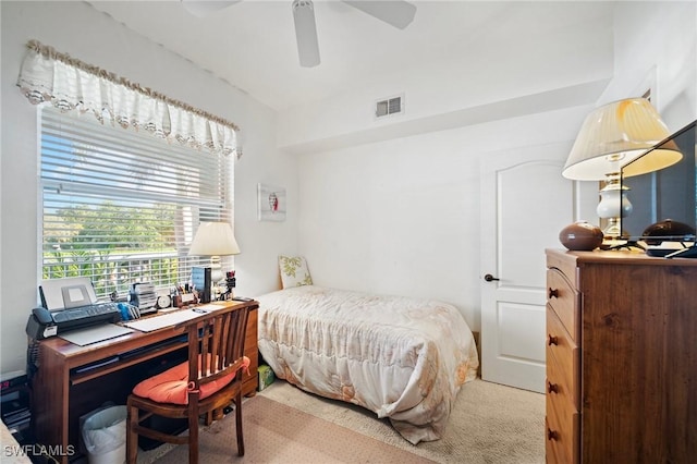 bedroom featuring ceiling fan and carpet