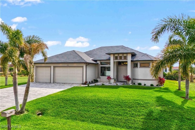 prairie-style home with a garage and a front yard