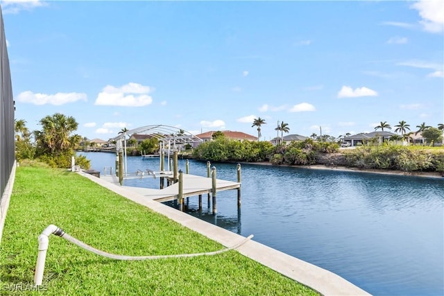 dock area featuring a water view and a yard