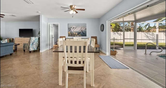 dining room with light tile patterned floors and ceiling fan