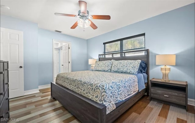 bedroom featuring ceiling fan and wood-type flooring