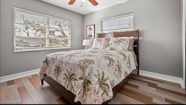 bedroom featuring hardwood / wood-style flooring and ceiling fan