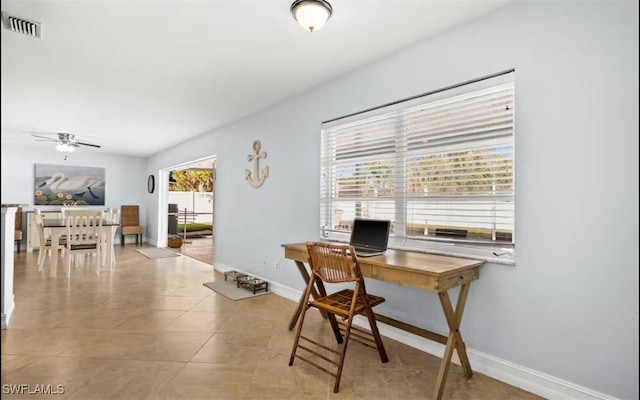 tiled office with ceiling fan and a healthy amount of sunlight