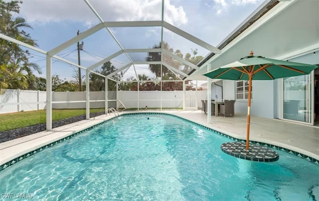 view of pool with a lanai and a patio