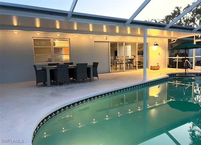 view of pool with a lanai and a patio area