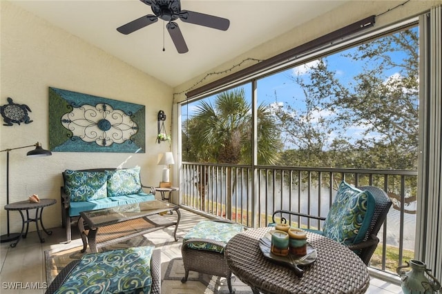 sunroom / solarium featuring vaulted ceiling and ceiling fan