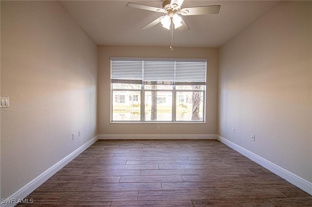 empty room with hardwood / wood-style floors and ceiling fan