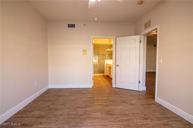 empty room featuring wood-type flooring