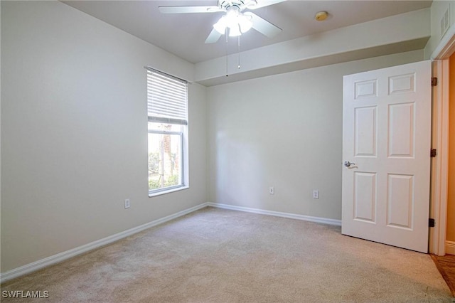 unfurnished room featuring ceiling fan and light colored carpet